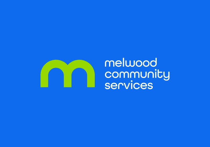 Melwood Community Services logo over blue background