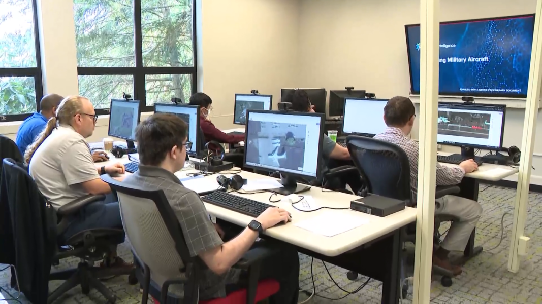 A photo of abilIT program participants taking part in training in a computer lab.